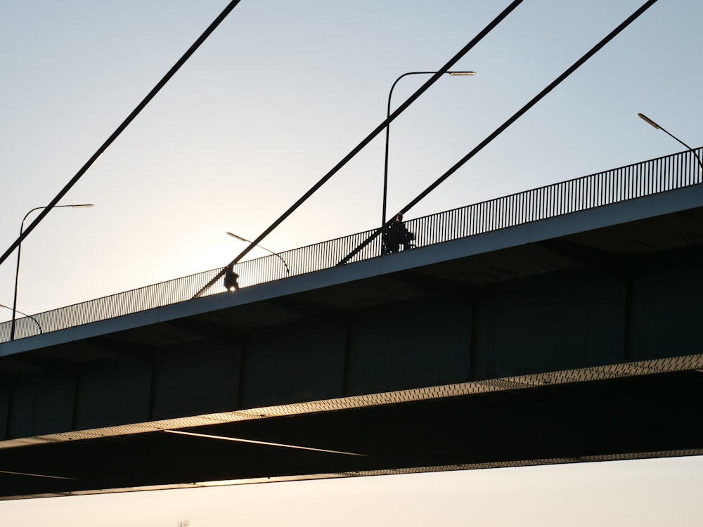 a bridge that has some wires above it