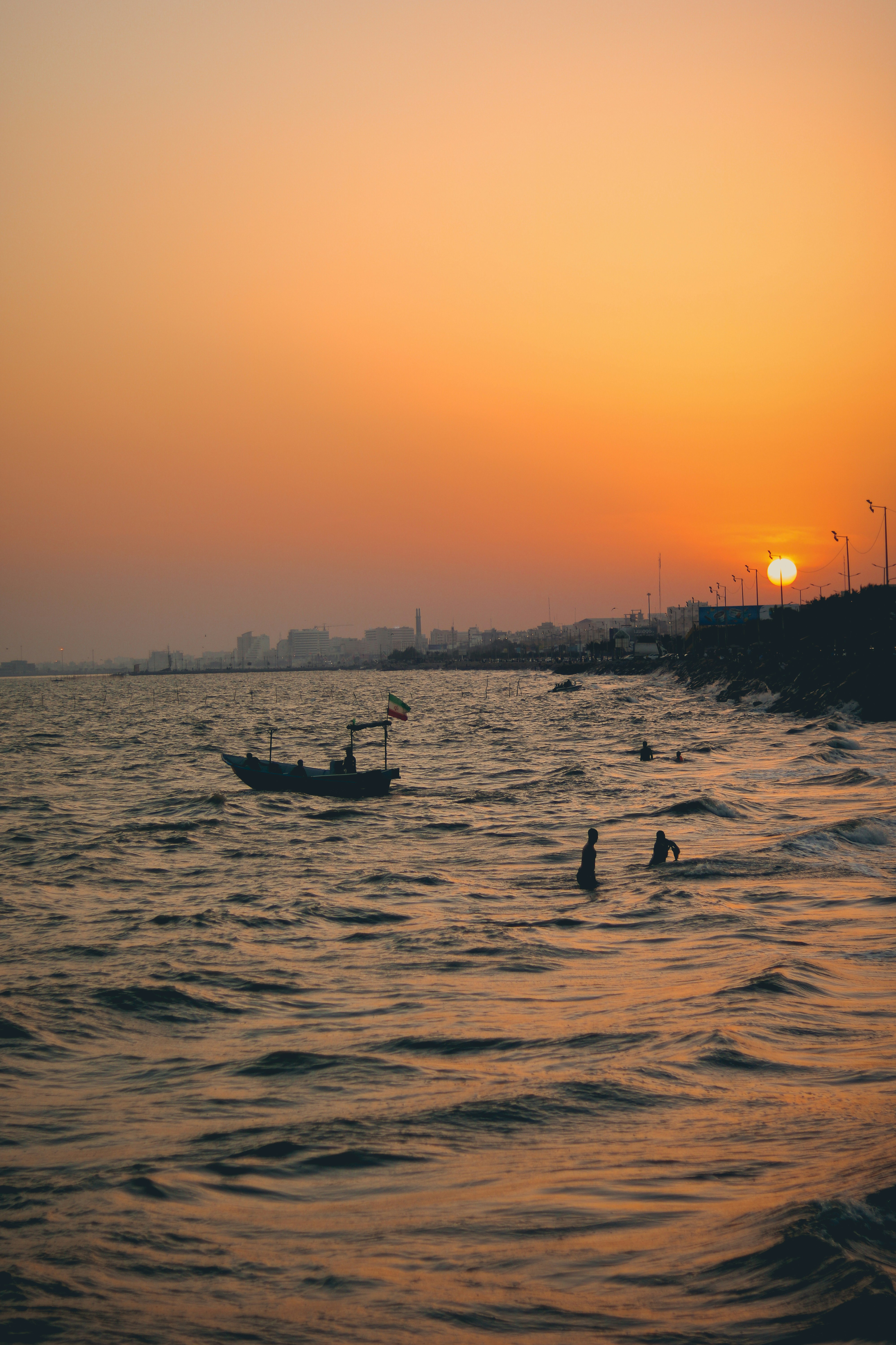 a boat floating on top of a body of water