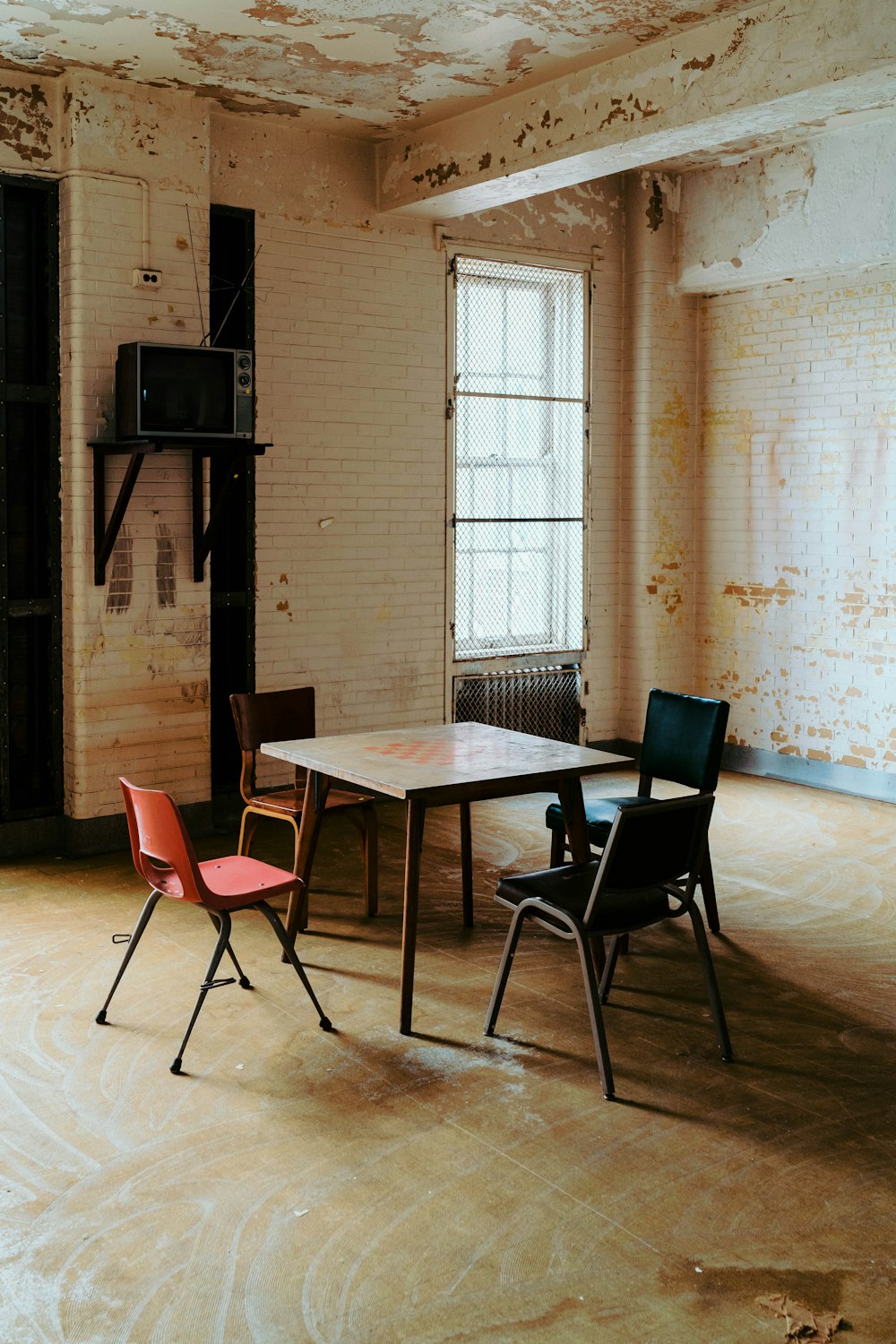 a room with a table and chairs in it