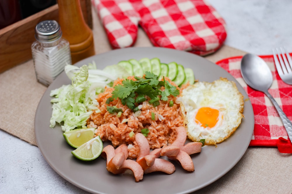 a plate of food on a table with a fork and knife