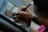 Close-up of hands sketching and designing digital artwork on a tablet screen.