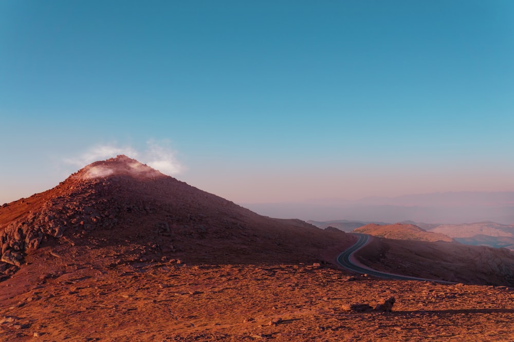 a mountain with a road going up the side of it