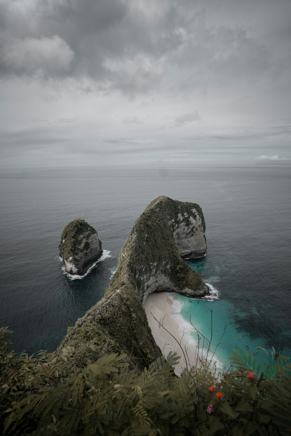 two large rocks sticking out of the ocean