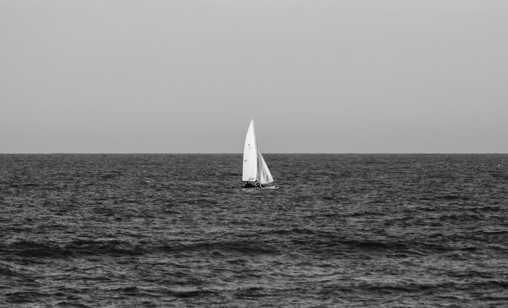 a sailboat in the middle of a large body of water