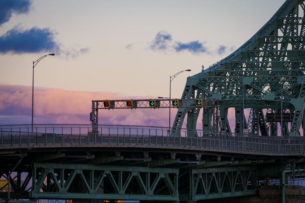 a bridge with a traffic light on top of it