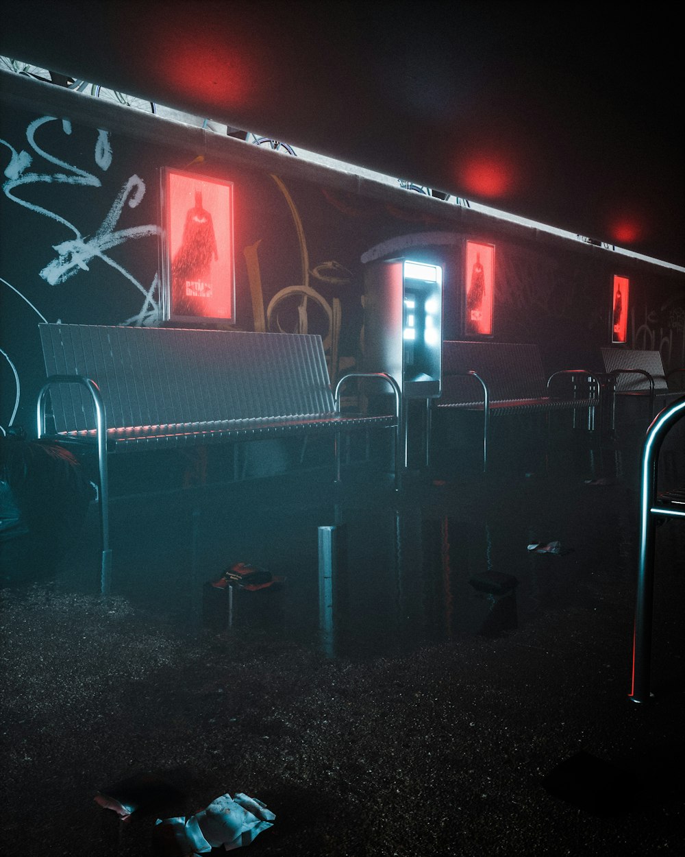 a dark photo of a train station with graffiti on the wall