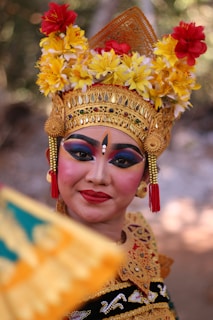 a woman in a costume with flowers on her head
