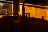 Interior of a cottage showing warm wooden furniture and soft lighting