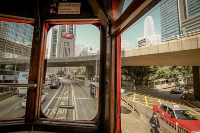a view of a city street from a bus window