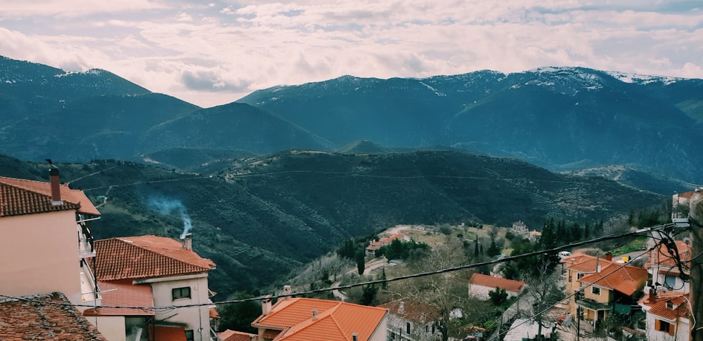 a view of a town with mountains in the background