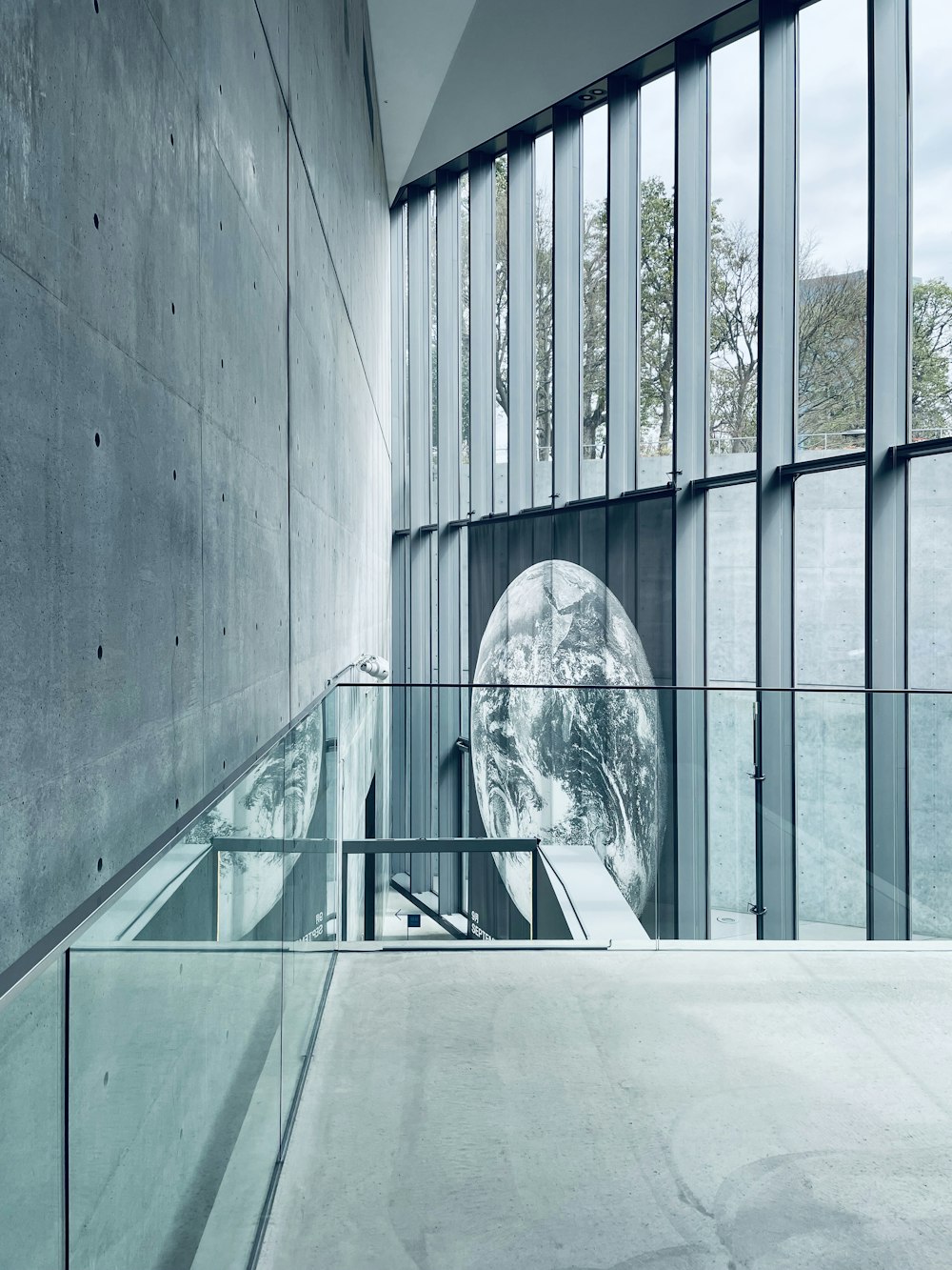 a building with glass walls and a staircase