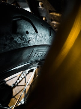 Close-up of a balanced tire on a wheel balancing machine.