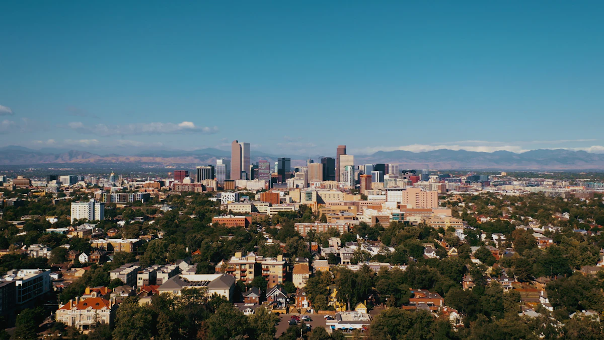 Denver city street with downtown buildings and mountain backdrop