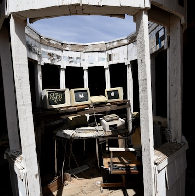 a room that has a bunch of old computers in it