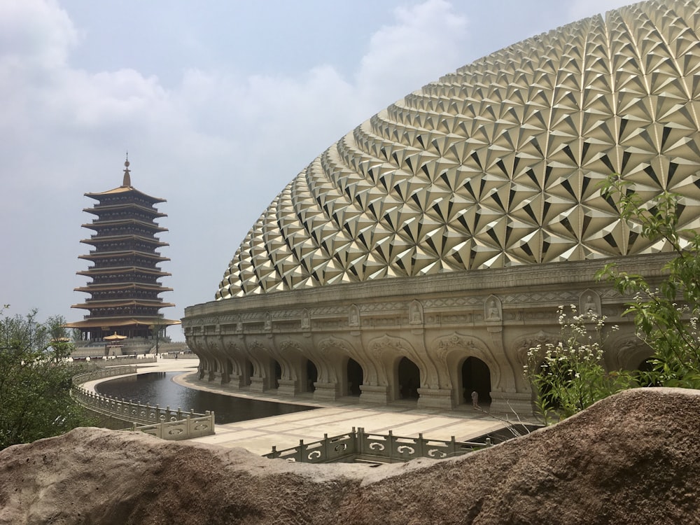 a large building with a pagoda in the background