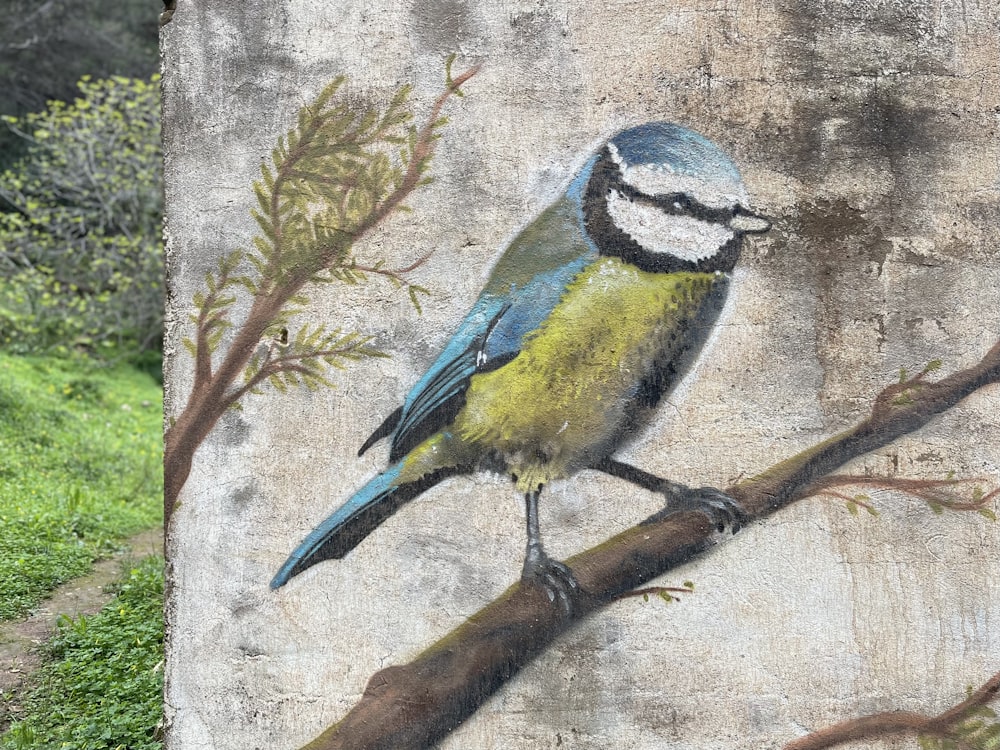 a painting of a bird on a tree branch