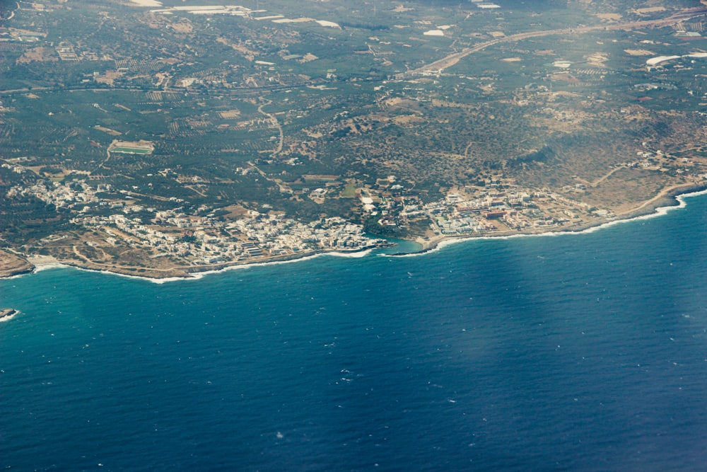 an aerial view of a city and a body of water