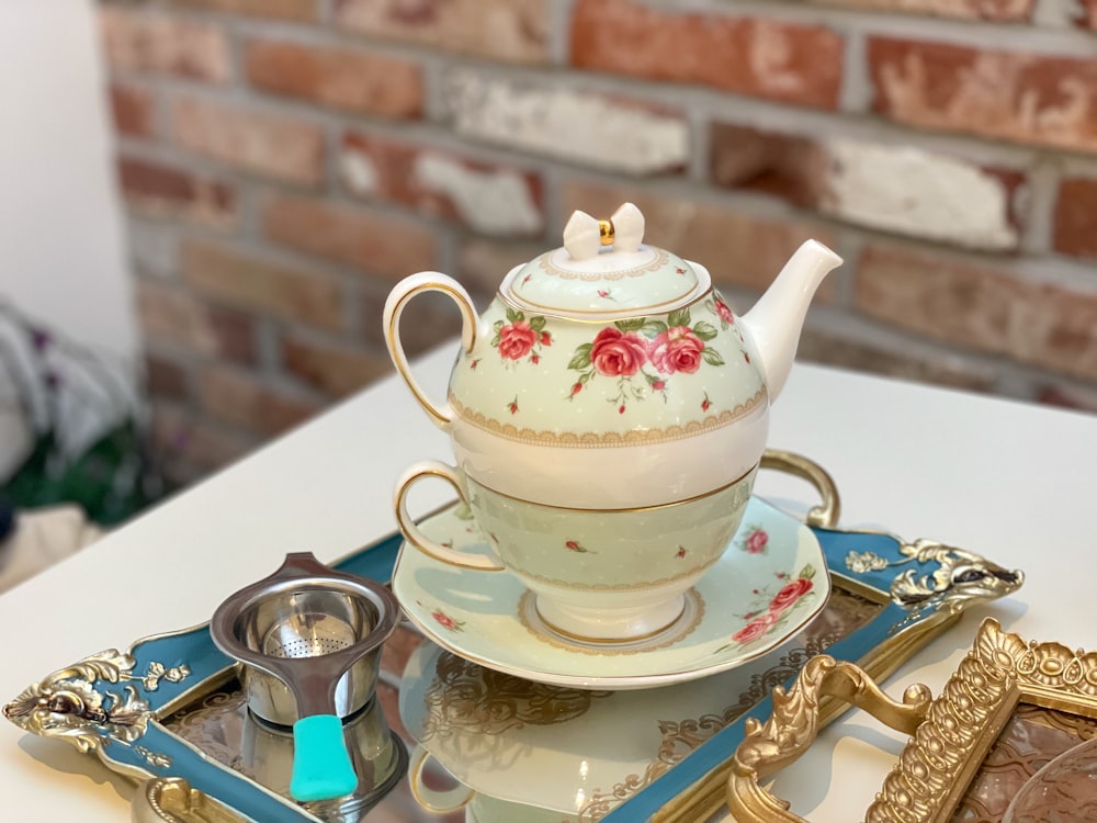 a tea pot sitting on top of a tray