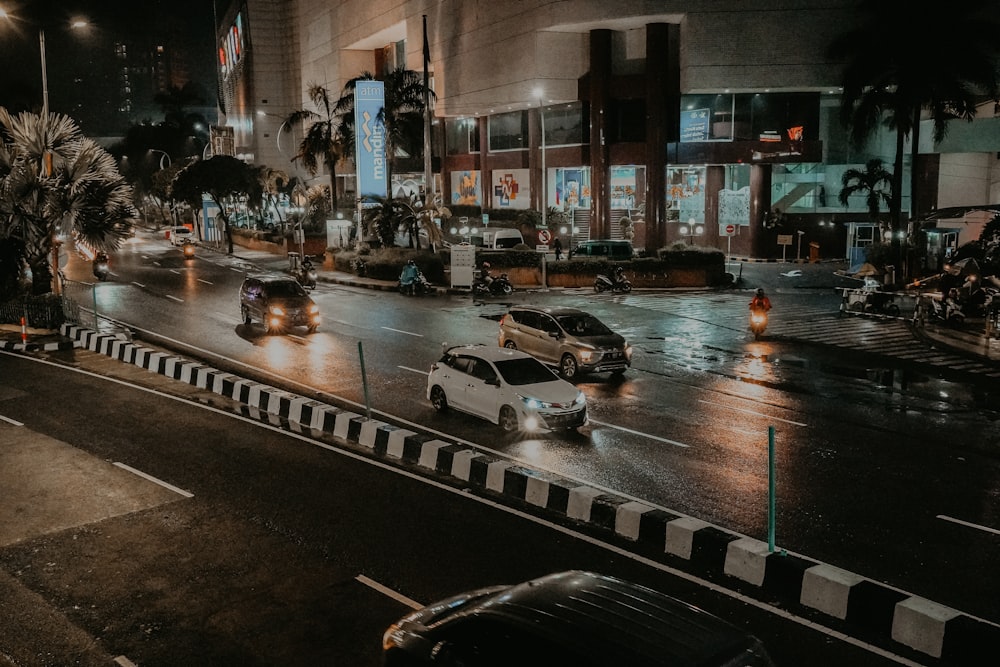 a city street filled with lots of traffic at night