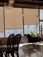 A beautifully installed roller blind in a modern living room.