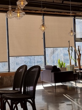 Bright living room with sleek roller blinds filtering natural light softly.