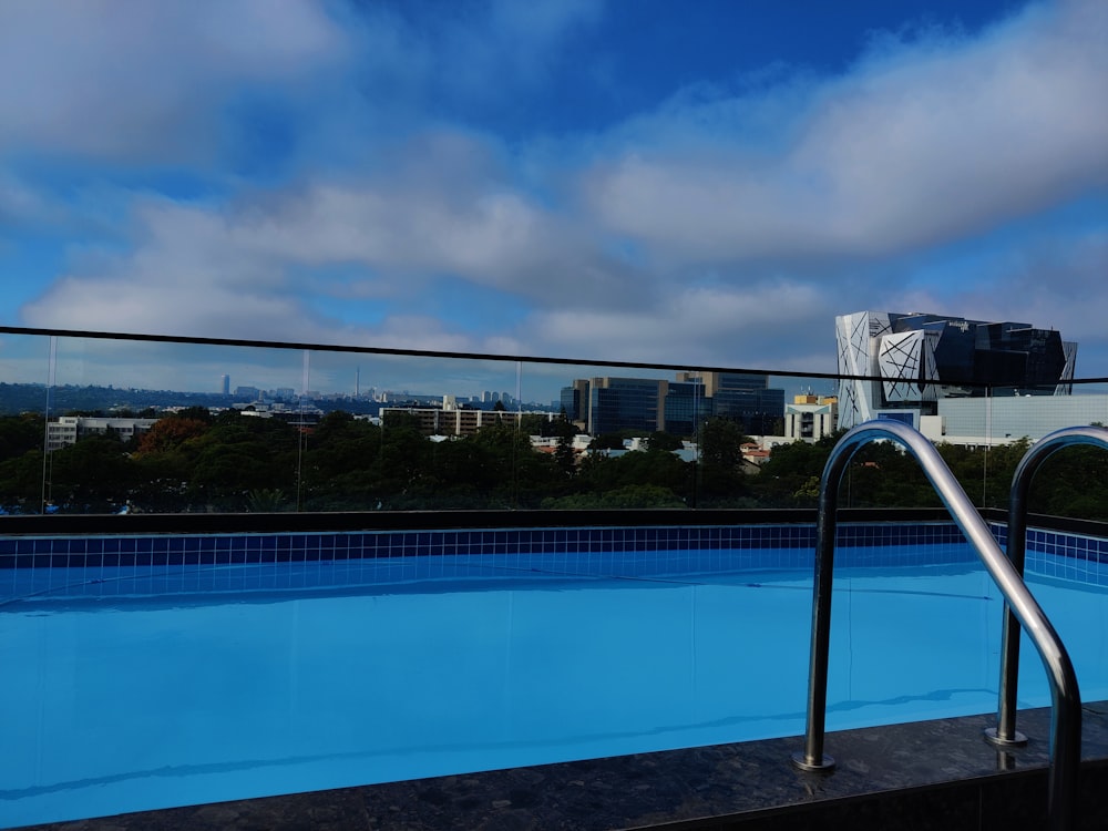 a swimming pool with a view of a city