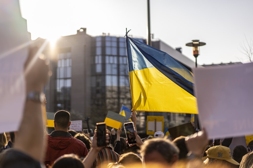 a group of people holding flags