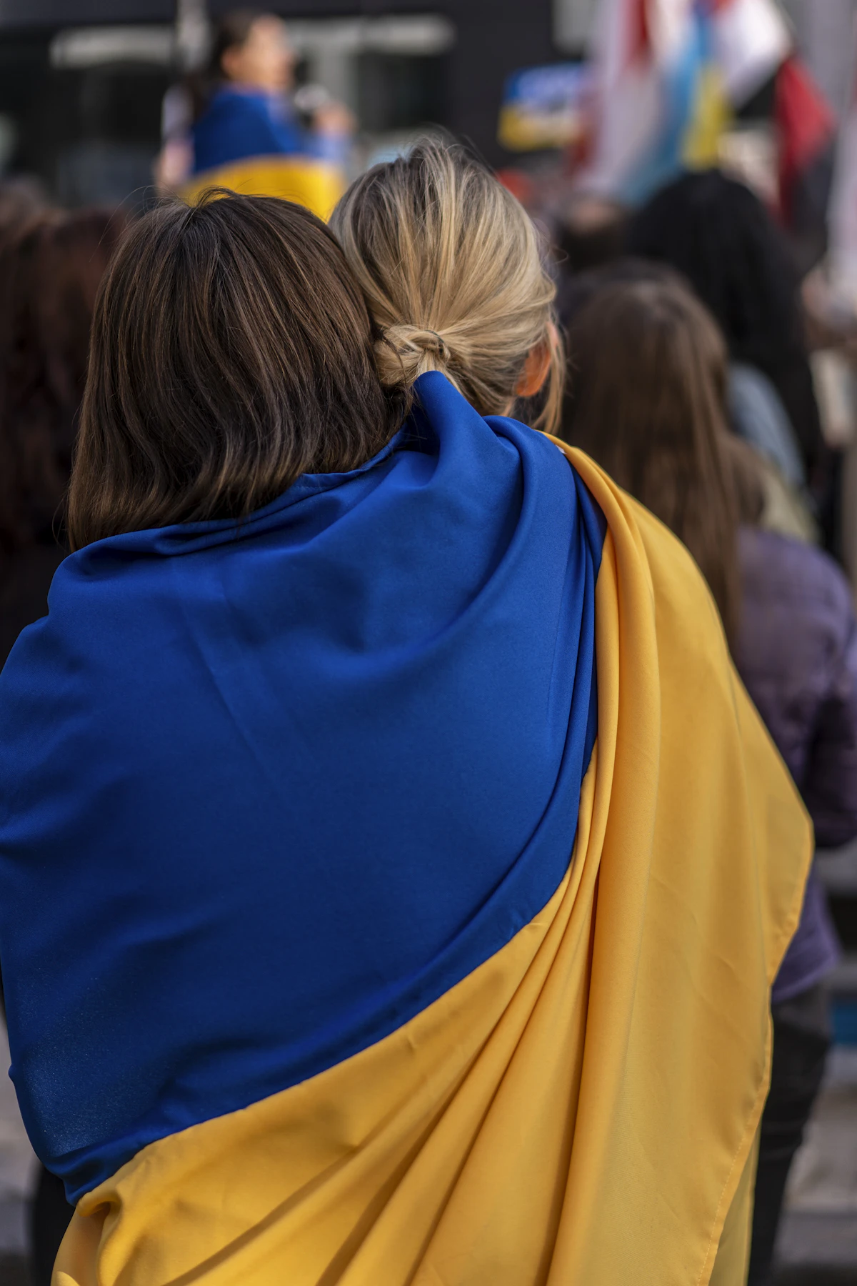 A person wrapped in the Ukrainian flag