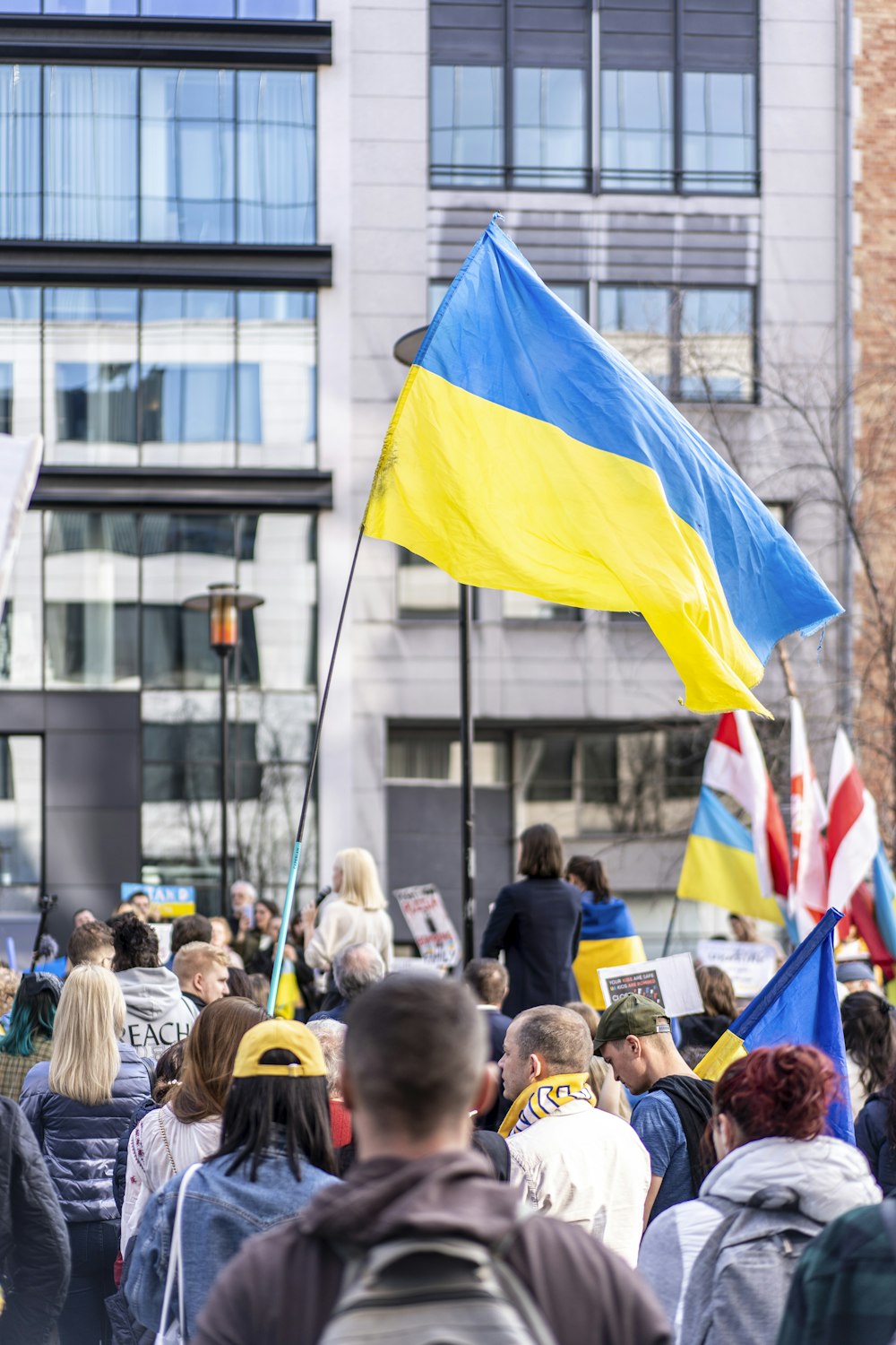 a group of people holding flags