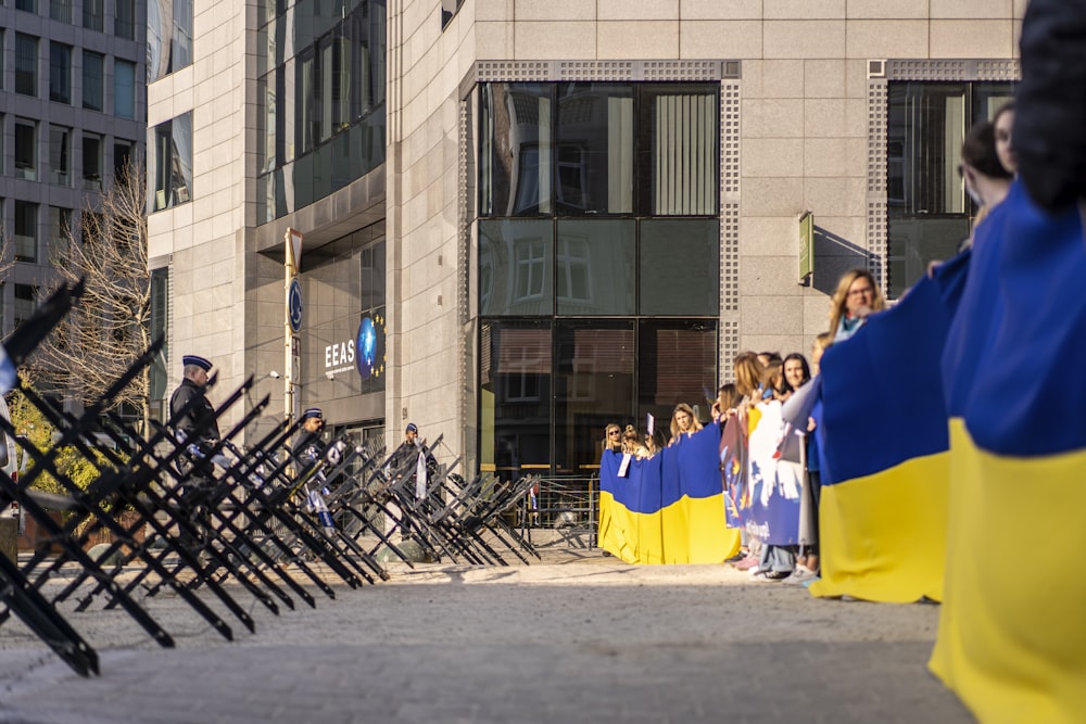 a group of people in clothing outside a building