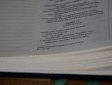 A close-up view of an open Bible showing a passage from Psalm 17. The text is clearly legible, with references to a prayer. The page edges are slightly yellowed, and the focus is primarily on the text content.