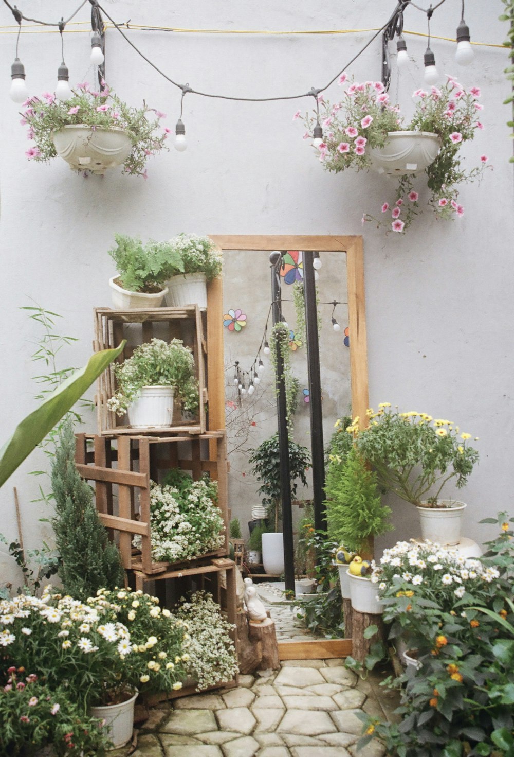 a room filled with lots of potted plants