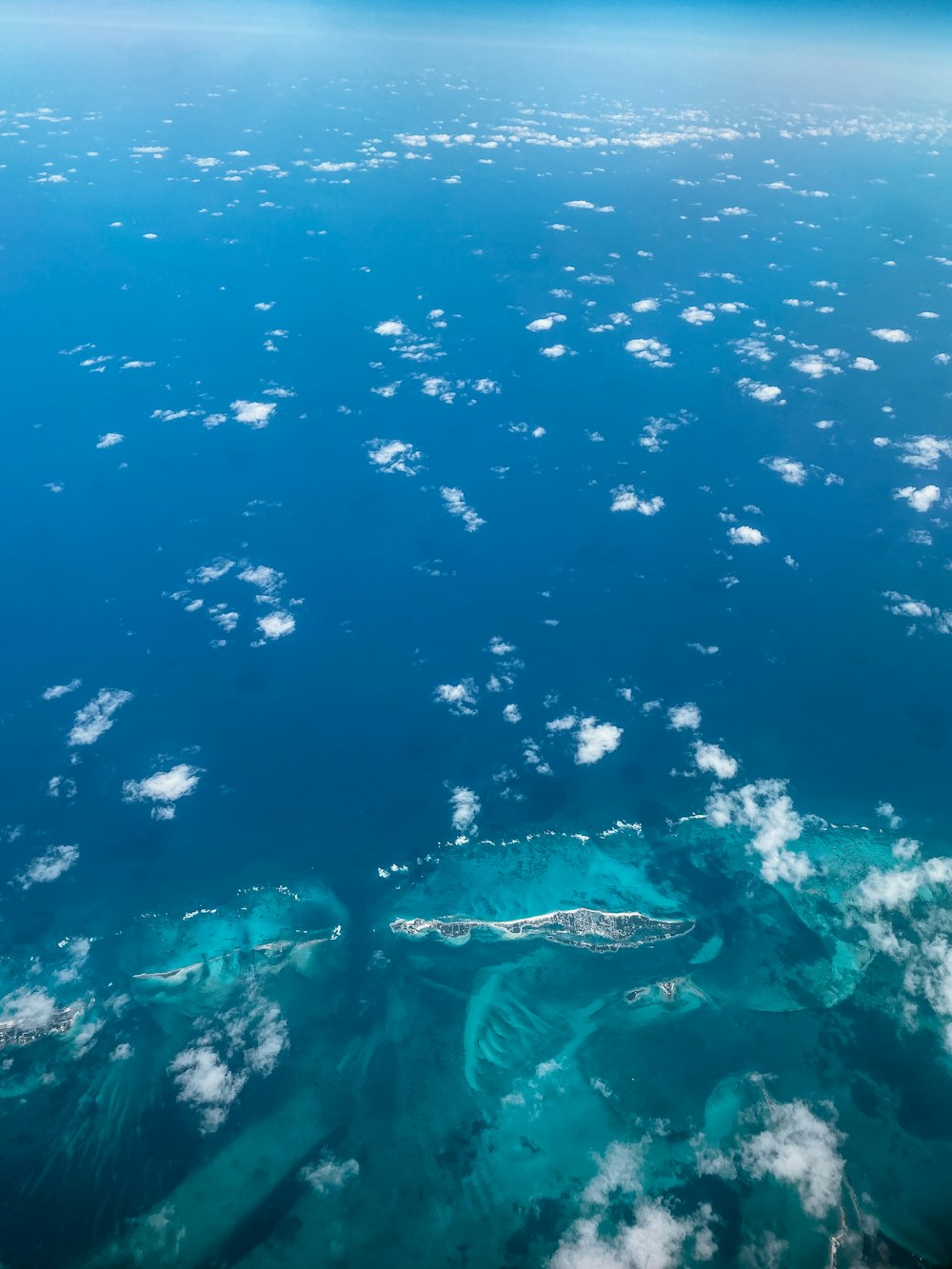 a view of the ocean from an airplane