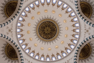 the ceiling of a building with a circular design