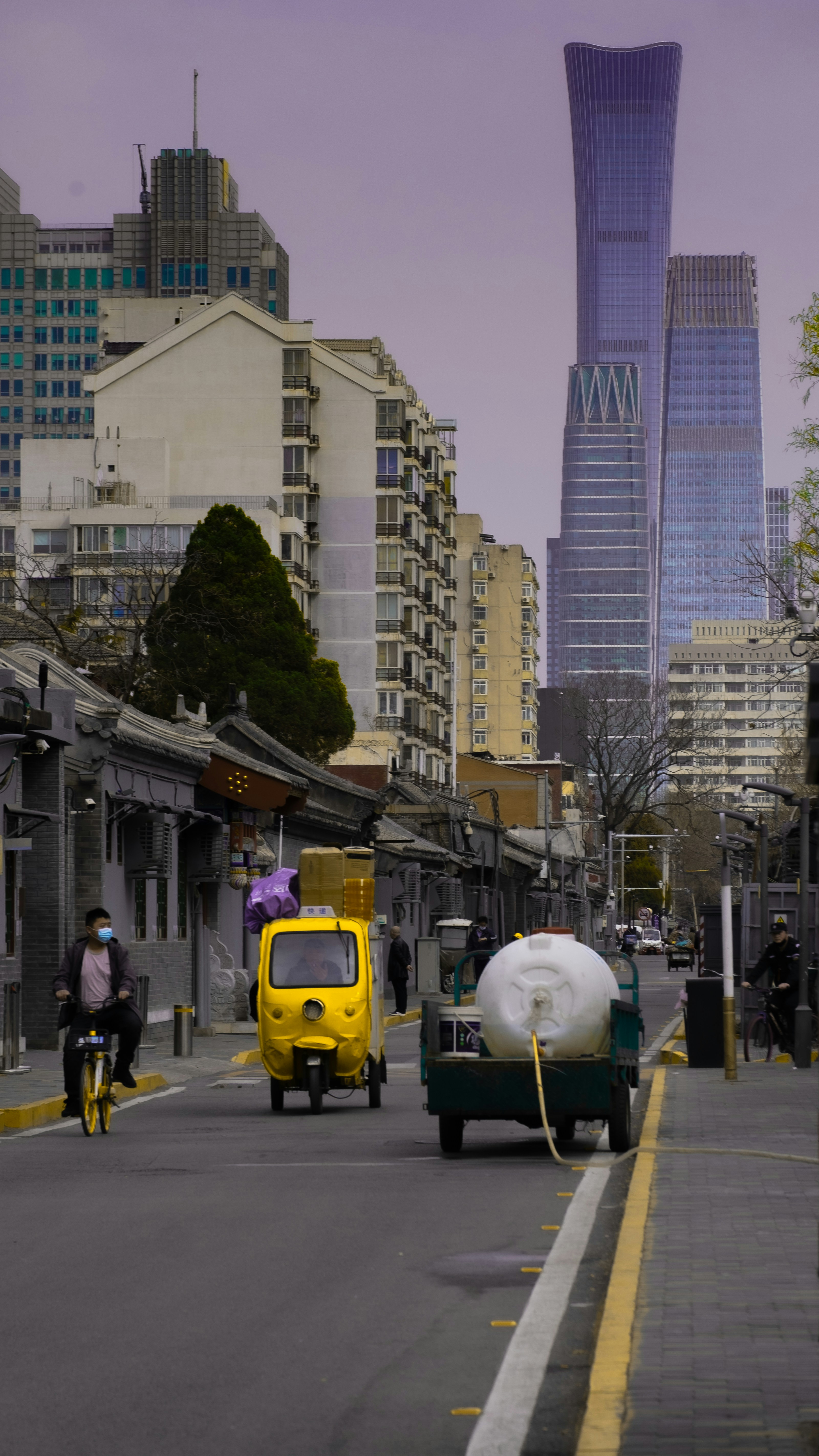 Yellow auto rickshaw on city road for local transportation booking