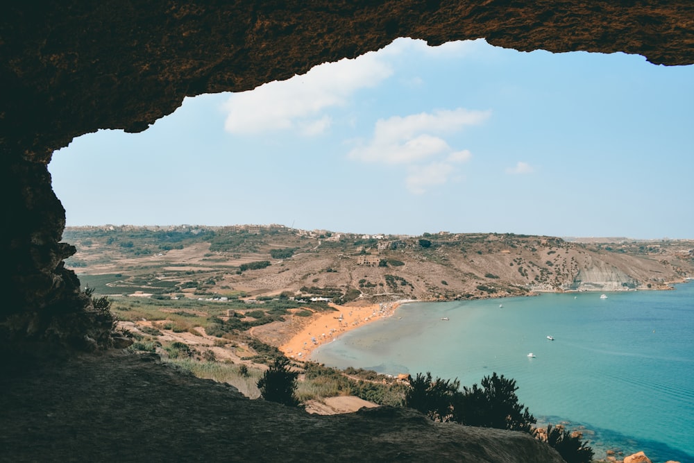 a view of the ocean from a cave