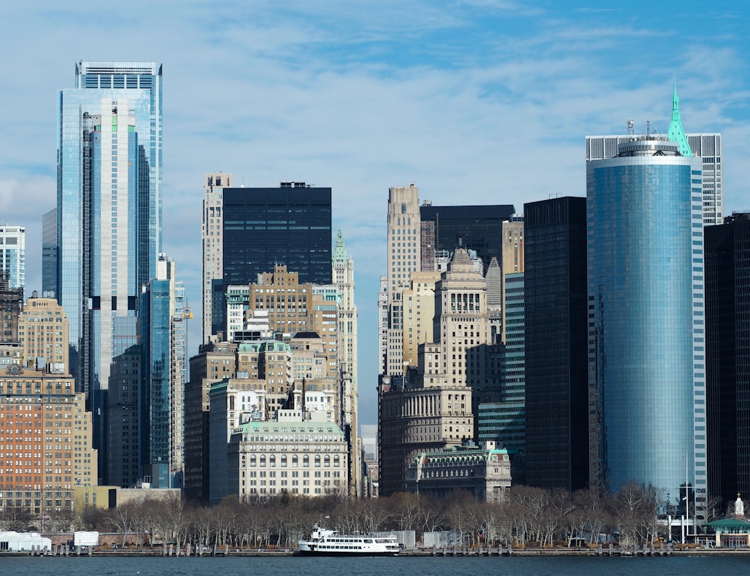 a large body of water surrounded by tall buildings,