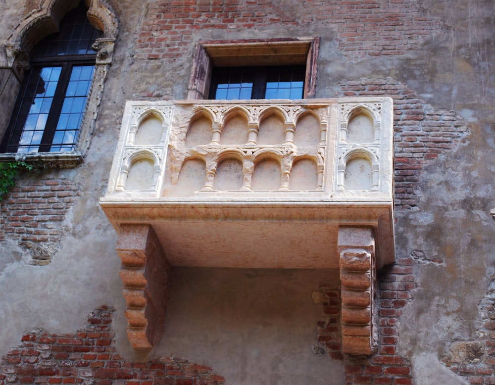 a balcony of a building with a window