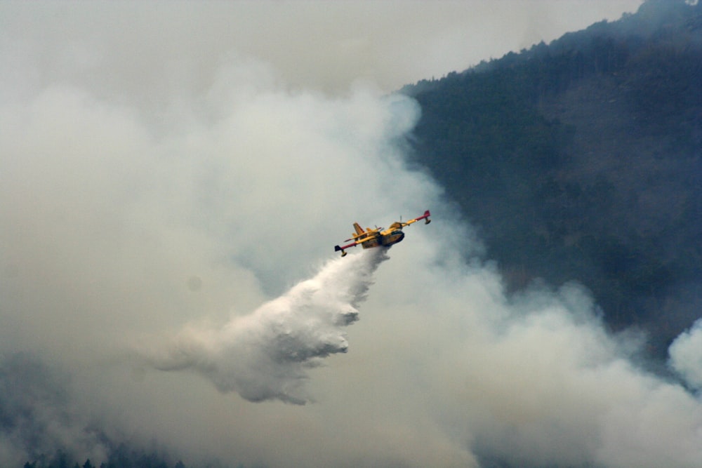 a plane flying through a cloud of smoke