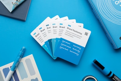 Close-up of colorful marketing and branding materials arranged on a desk.
