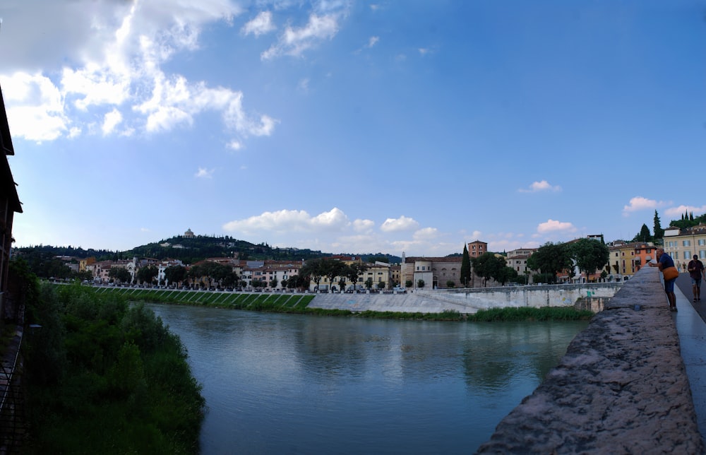 a river running through a city next to tall buildings