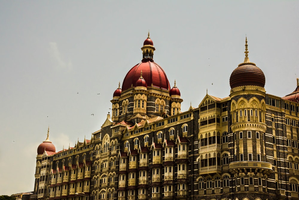 a large building with a red dome on top of it