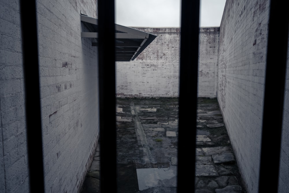 a jail cell with bars on the doors