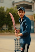 Young cricketer in action during a local match, bat mid-swing.