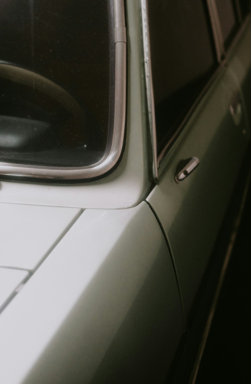 a close up of a car with a window open