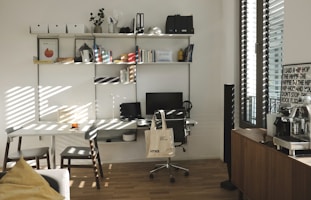 A home office setup featuring printing supplies and ergonomic accessories on a tidy desk.