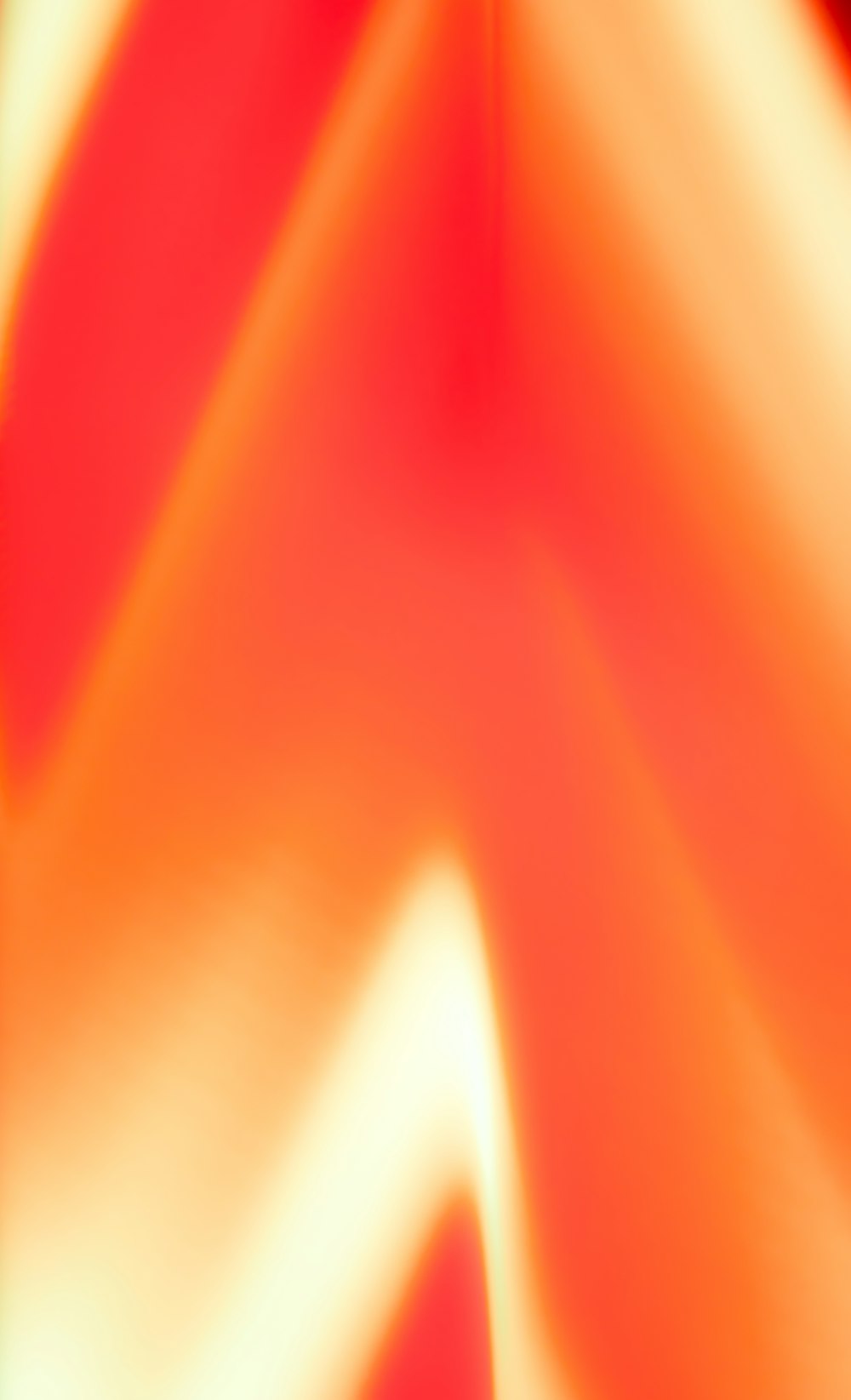 a blurry image of a red and yellow background