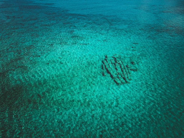 Wide shot of a submerged wreck with clear water visibility.
