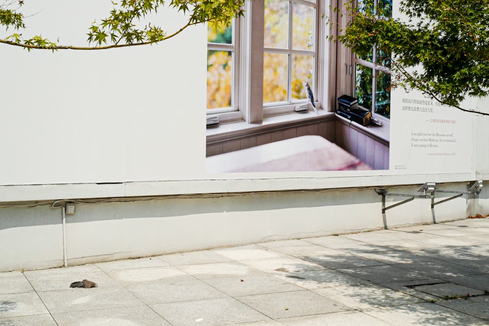 a white building with a large picture of a window