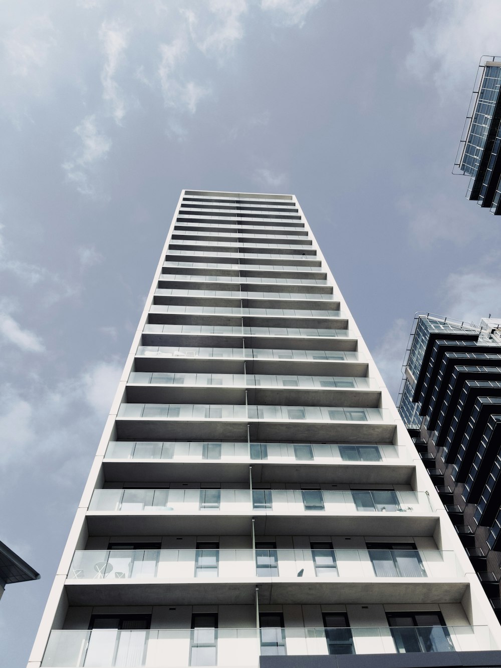 looking up at a tall building from the ground